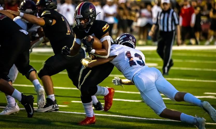 A football player gets tackled
